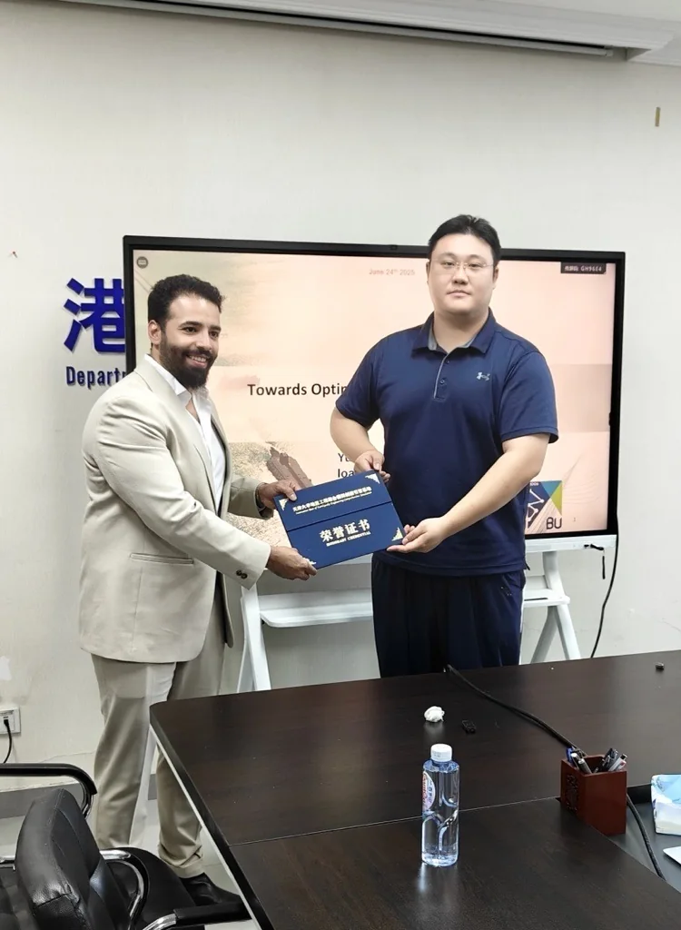 Yusuf Almalki presenting a lecture at Tianjin University, receiving an honorary certificate from a university colleague